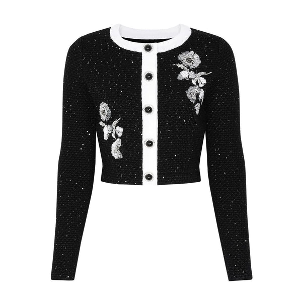 Black cardigan with floral embroidery on a white background