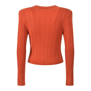 Orange ribbed sweater on a white background