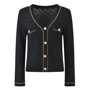 Black cardigan with gold chain details on a white background
