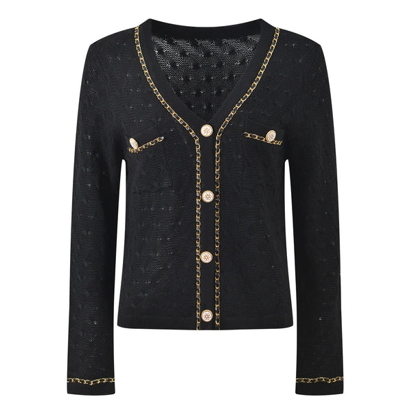 Black cardigan with gold chain details on a white background
