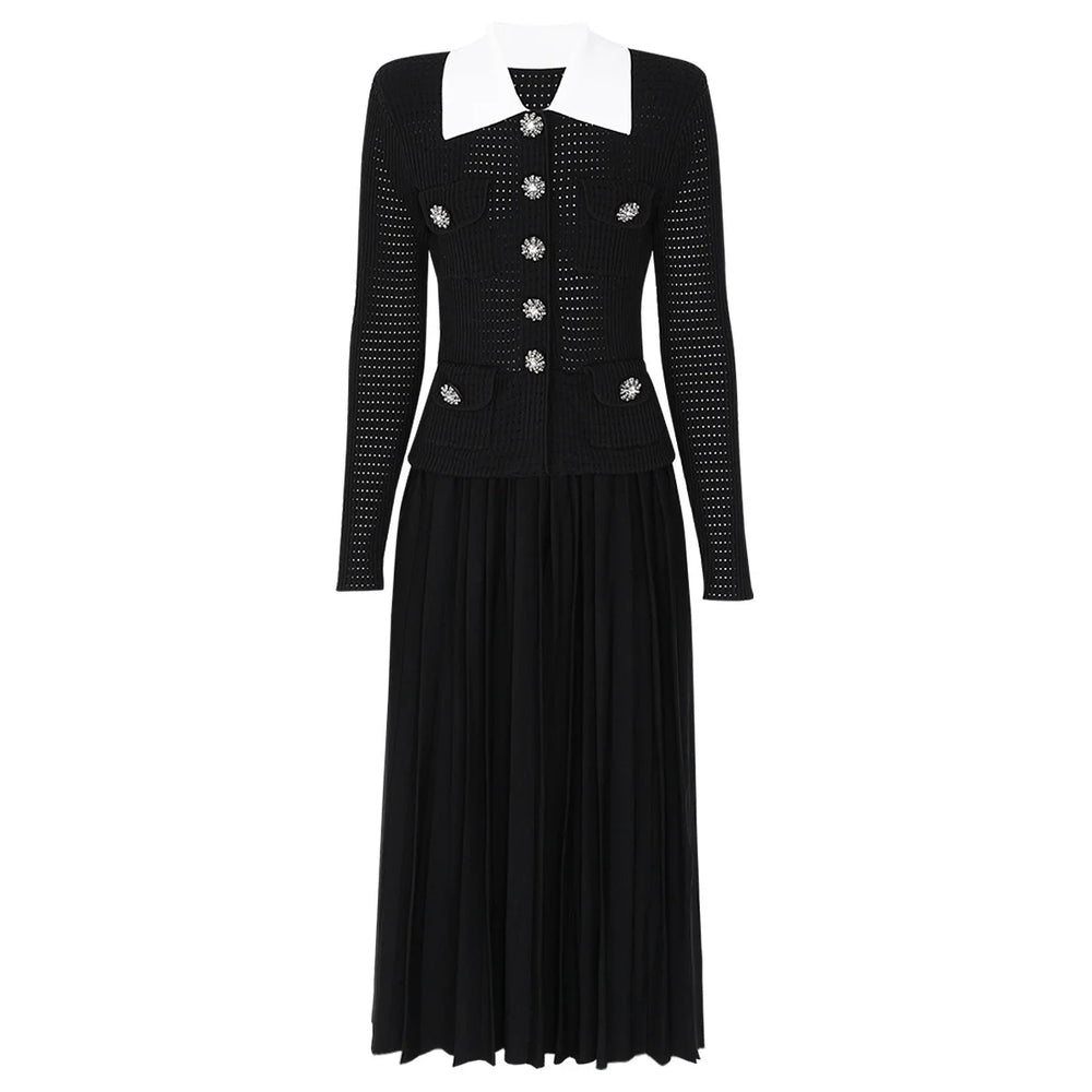 Black dress with white collar and embellishments on a white background