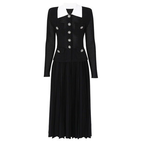 Black dress with white collar and embellishments on a white background