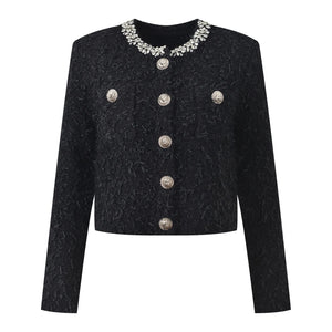 Black textured jacket with silver buttons and embellished collar on a white background