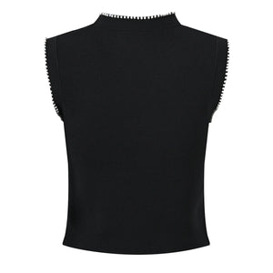 Black sleeveless top with decorative trim on a white background