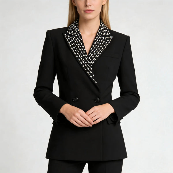 Black blazer with a patterned collar worn by a person on a white background
