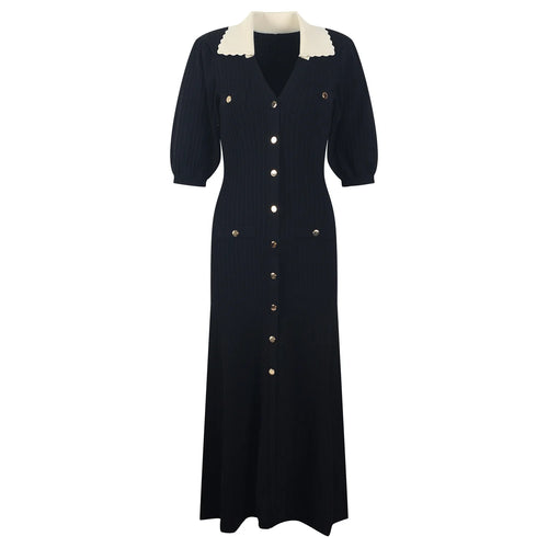 Black dress with white collar and buttons on a white background