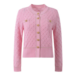 Pink cardigan with gold buttons on a white background