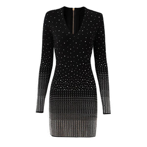 Black dress with silver embellishments on a white background