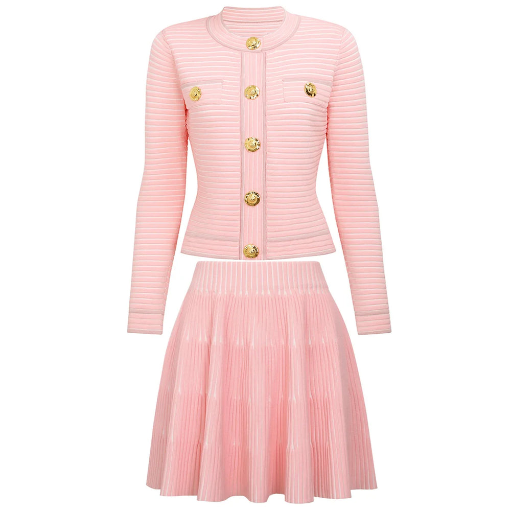 Pink ribbed cardigan and pleated skirt set on a white background