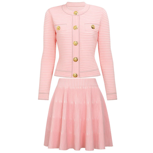 Pink ribbed cardigan and pleated skirt set on a white background