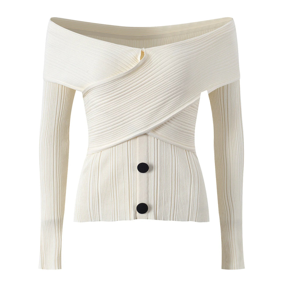 White ribbed knit cardigan with a button detail on a white background