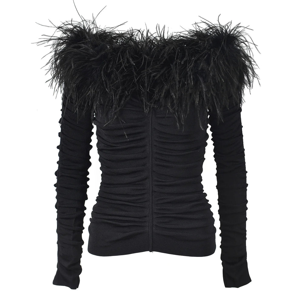 Black off-shoulder top with feathered trim on a white background