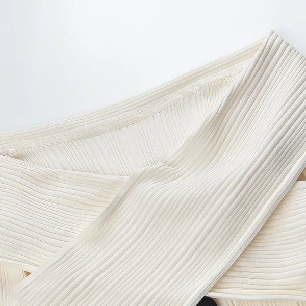 Close-up of textured white fabric on a light gray background