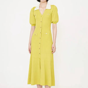 Yellow dress worn by a person on a white background