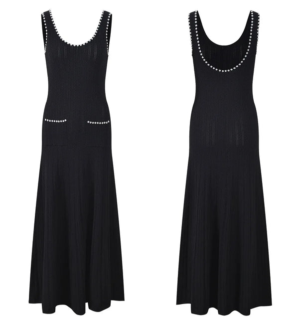 Black sleeveless dress with bead embellishments on a white background