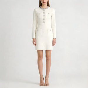 White dress with long sleeves and buttons on a white background