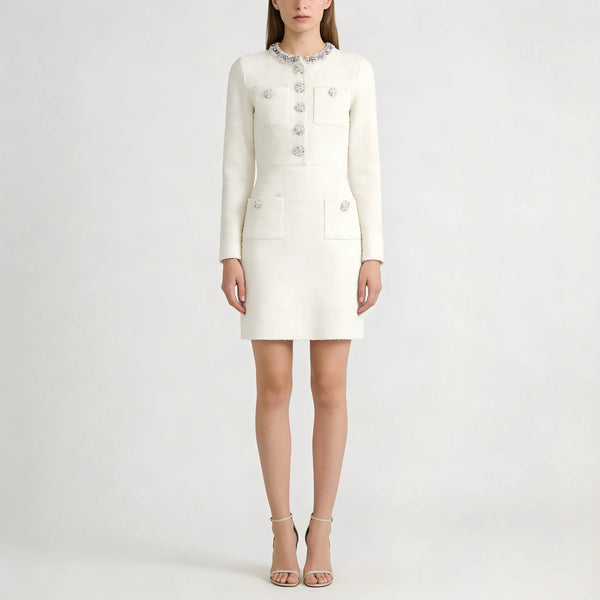 White dress with long sleeves and buttons on a white background