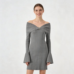 Woman wearing a gray off-shoulder dress on a white background