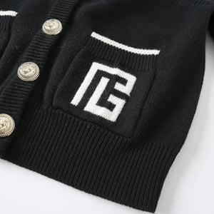 Black cardigan with a logo on the chest and buttons, on a white background