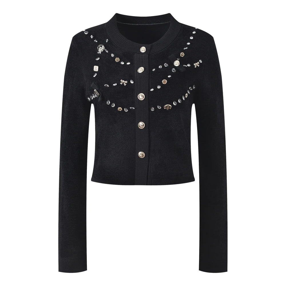 Black jacket with decorative buttons and embellishments on a white background