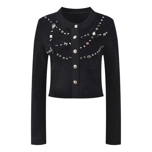 Black jacket with decorative buttons and embellishments on a white background