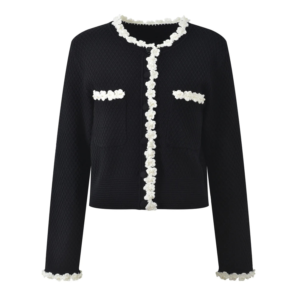 Black jacket with white floral details on a white background