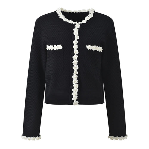 Black jacket with white floral details on a white background