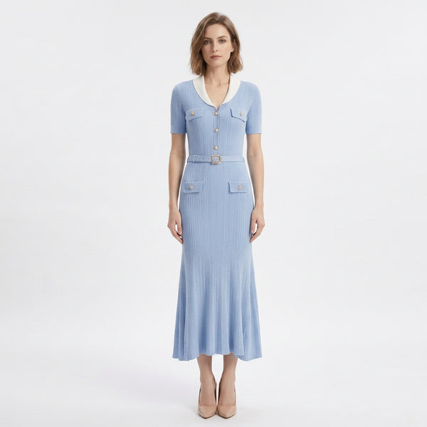 A light blue ribbed knit midi dress with short sleeves, a white collar, gold-tone buttons, and a matching belt with a decorative buckle, shown on a white background.