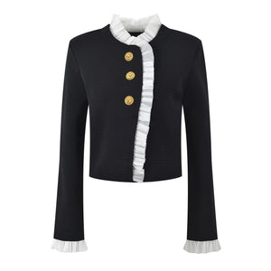 Black jacket with white ruffled trim and gold buttons on a white background
