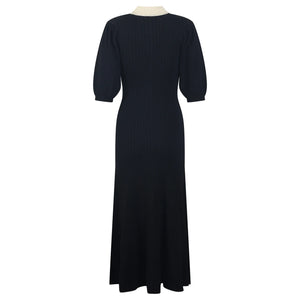 Black dress on a mannequin against a white background