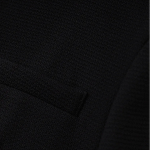 Close-up of a textured black fabric surface