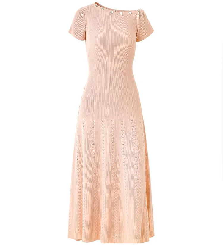 Pink dress with decorative buttons on a white background