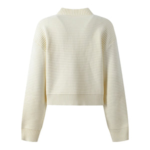White ribbed sweater on a white background