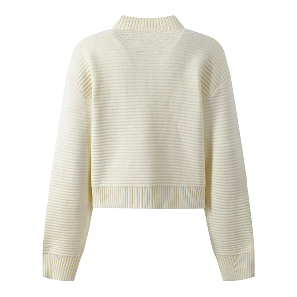White ribbed sweater on a white background