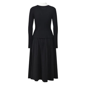 Black dress with long sleeves on a white background