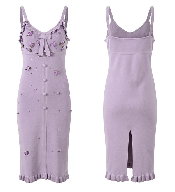 Two lavender dresses with floral embellishments on a white background