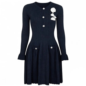 Black dress with white floral design on a white background