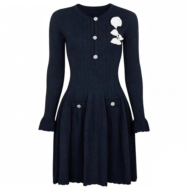 Black dress with white floral design on a white background