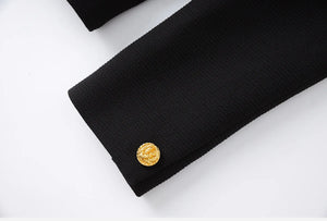 Black coat with a gold button on a white background