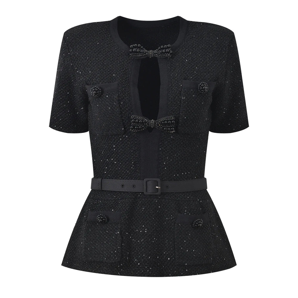 Black textured dress with a bow detail on a white background