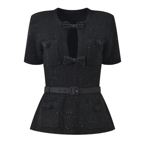 Black textured dress with a bow detail on a white background