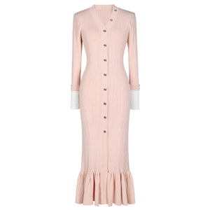 Pink dress with buttons on a white background