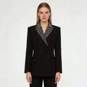 Black blazer with a patterned collar worn by a model on a white background