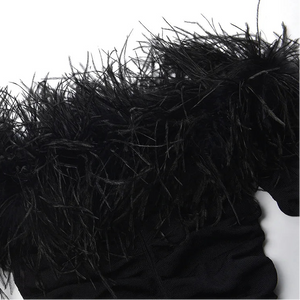 Close-up of a black fur coat with a hood on a white background