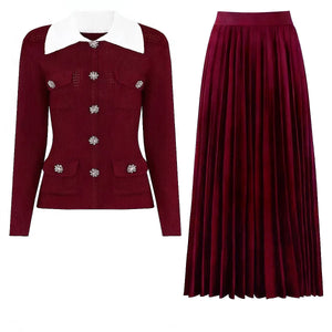 Red cardigan with white collar and pleated red skirt on a white background