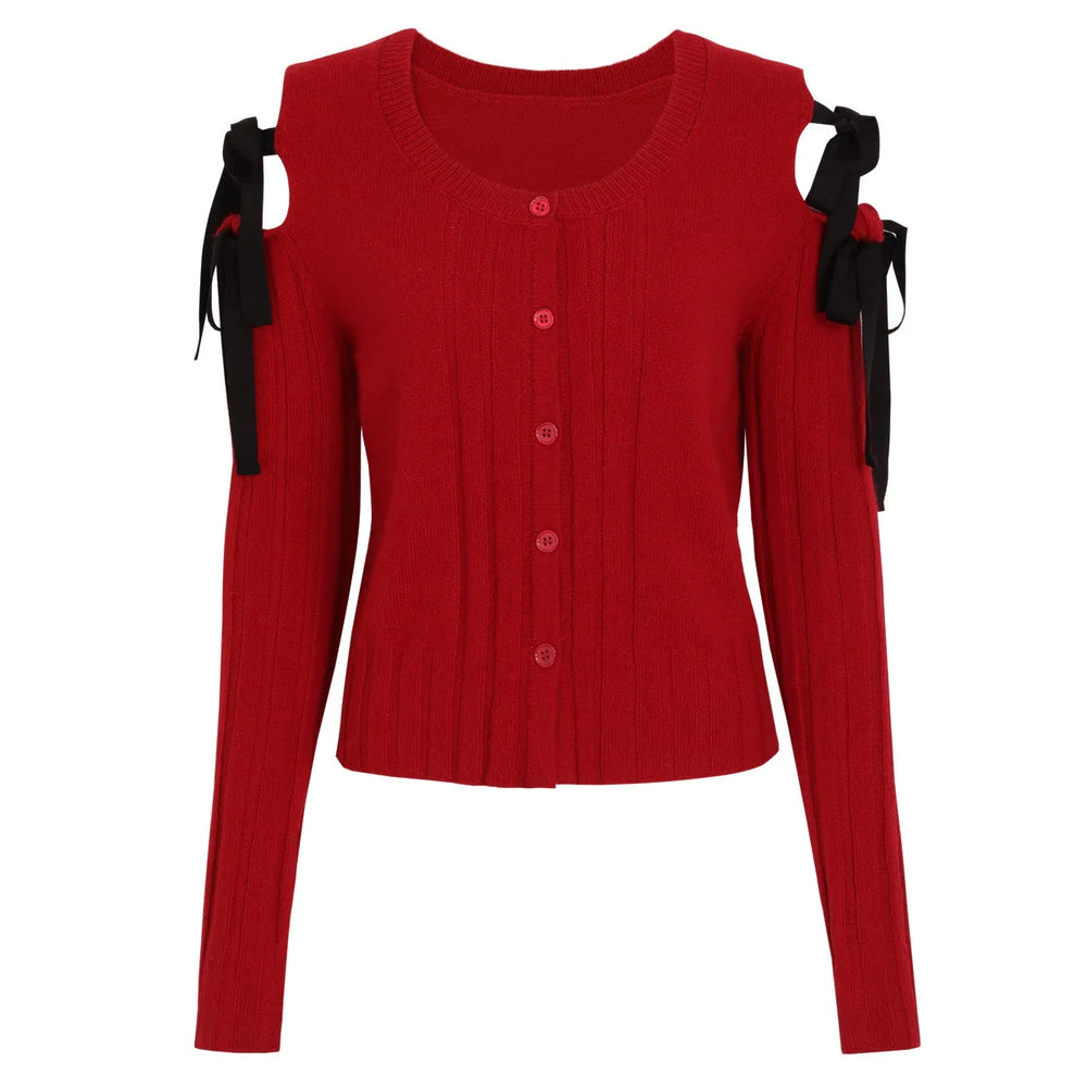 Red sweater with black ribbons on shoulders against a white background