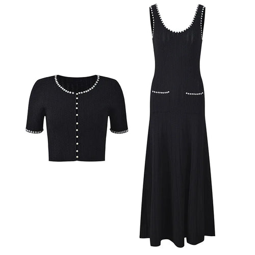 Black dress with white embellishments on a white background