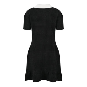 Black dress with white collar on a white background