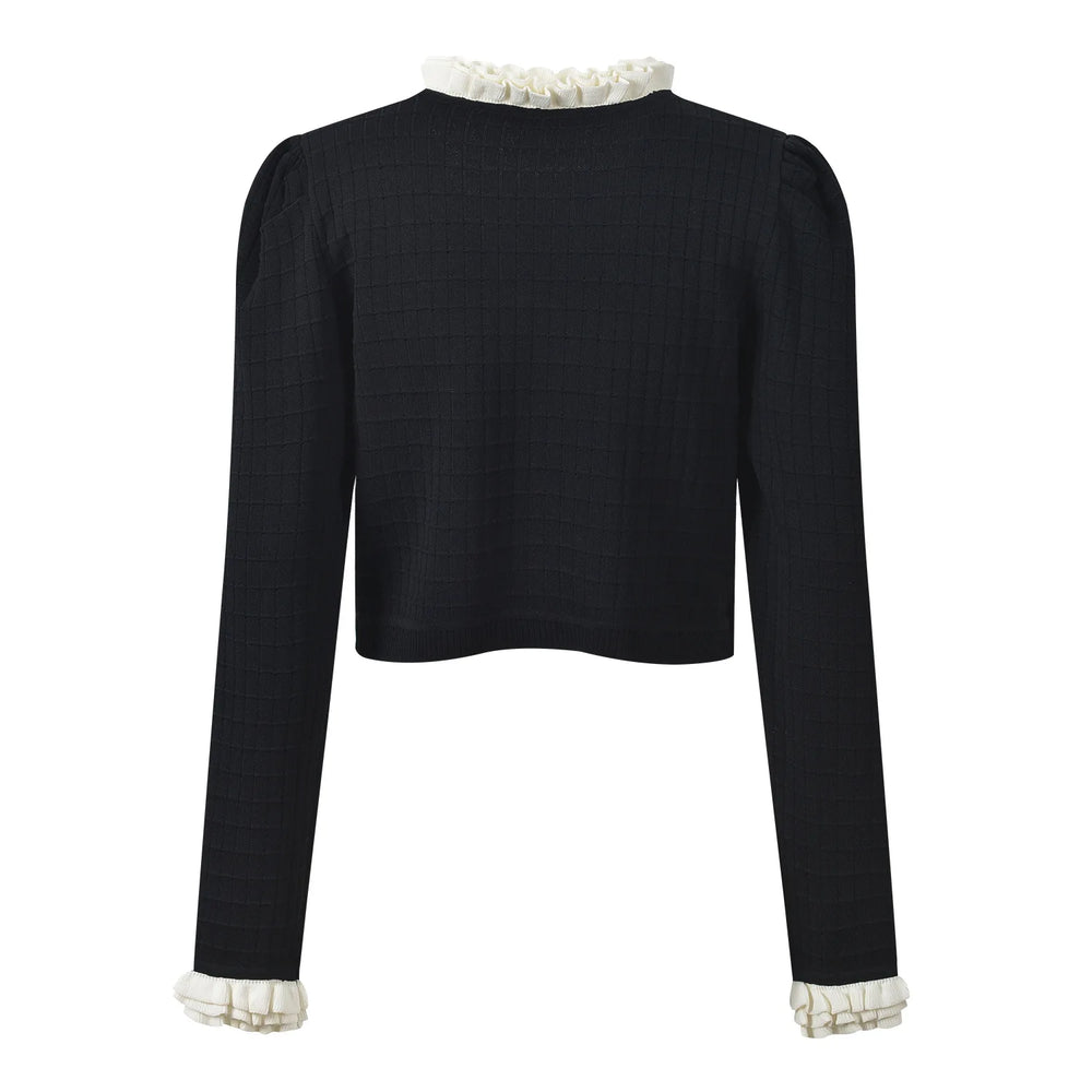 Black jacket with white lace trim on a white background