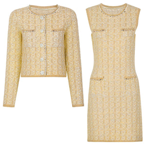 Yellow tweed jacket and dress set on a white background